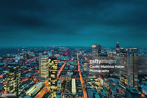view of city at night - frankfurt germany skyline stock-fotos und bilder