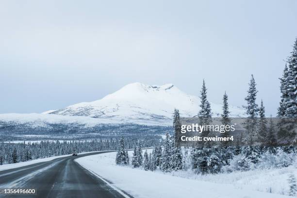 alaska highway winter driving - interior alaska bildbanksfoton och bilder
