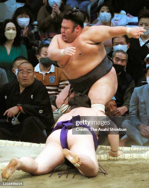 Sekiwake Meisei pushes ozeki Takakeisho out of the ring to win on day ten of the Grand Sumo Kyushu Tournament at the Fukuoka Convention Center on...