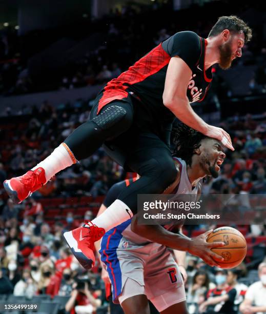 Jusuf Nurkic of the Portland Trail Blazers lands on Isaiah Stewart of the Detroit Pistons during the fourth quarter at Moda Center on November 30,...