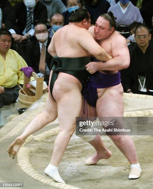 Tochinoshin pushes Chiyoshoma out of the ring to win on day eleven of the Grand Sumo Kyushu Tournament at the Fukuoka Convention Center on November...