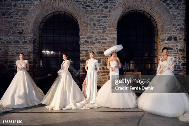 Models are seen backstage ahead of the Hakan Akkaya x Cinderella Bridal Capsule Collection at Tersane Istanbul on November 30, 2021 in Istanbul,...