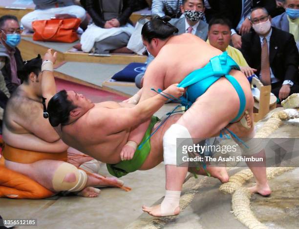 Kotonowaka puts down Akua to win on day eleven of the Grand Sumo Kyushu Tournament at the Fukuoka Convention Center on November 24, 2021 in Fukuoka,...