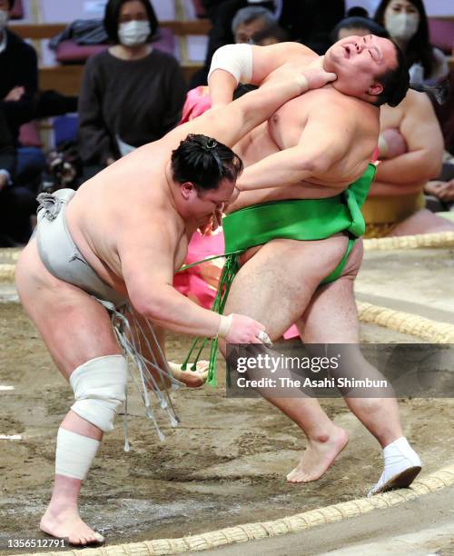 Hokutofuji pushes Chiyomaru out of the ring to win on day eleven of the Grand Sumo Kyushu Tournament at the Fukuoka Convention Center on November 24,...