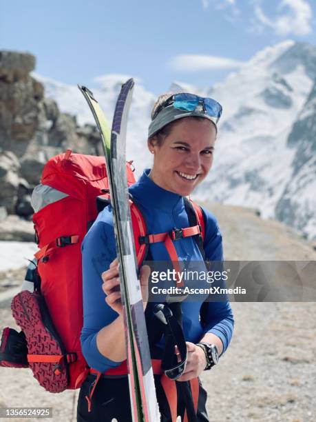portrait of female backcountry skier, smiling - ski poles stock pictures, royalty-free photos & images