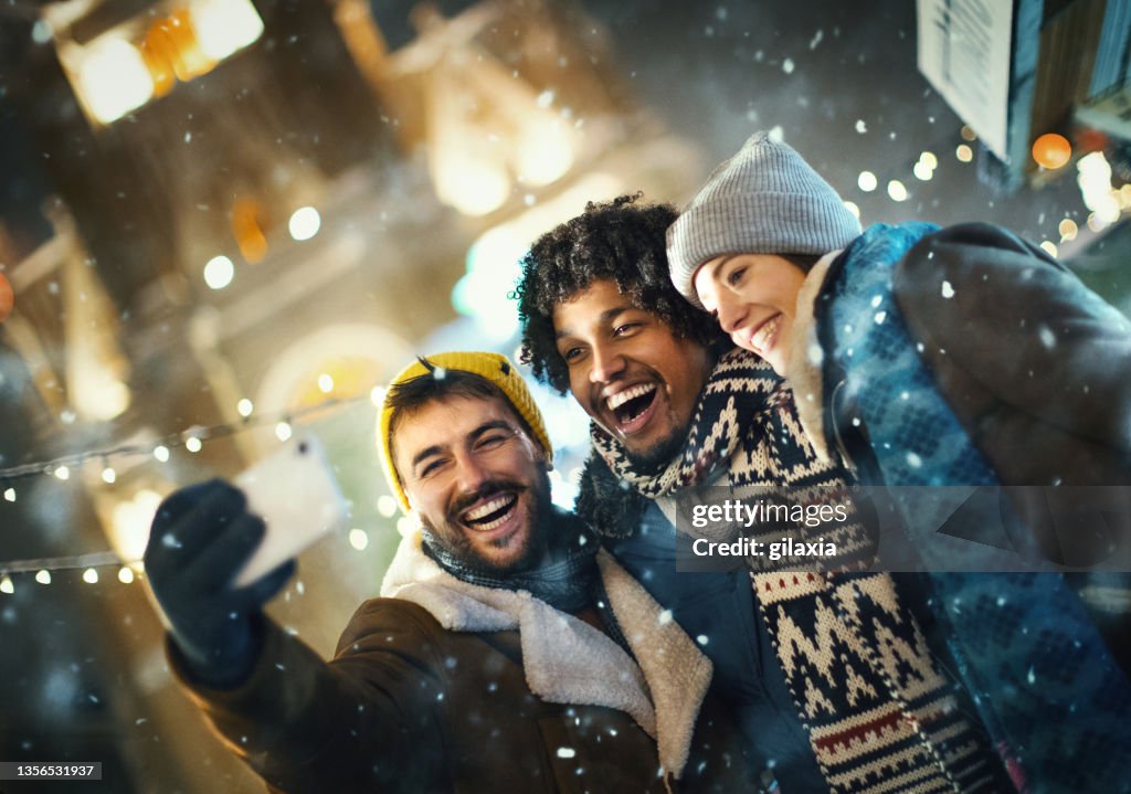Friends taking a break during Christmas eve shopping.