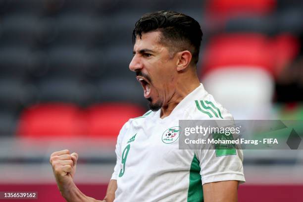 Baghdad Bounedjah of Algeria celebrates after scoring their team's first goal during the FIFA Arab Cup Qatar 2021 Group D match between Algeria and...