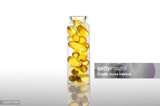 organic, bio cosmetics healthy concept with bottles with oil capsules with omega 3, vitamin d on white background. - fish oil foto e immagini stock