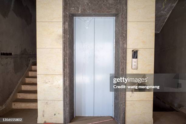 stairs and elevator shafts in a roughcast house - lift foto e immagini stock