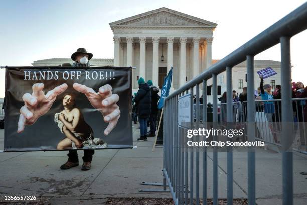 Protesters, demonstrators and activists gather in front of the U.S. Supreme Court as the justices hear arguments in Dobbs v. Jackson Women's Health,...