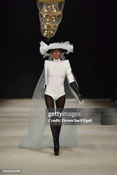 Model walks the runway during the Hakan Akkaya x Cinderella Bridal Capsule Collection show at Tersane Istanbul on November 30, 2021 in Istanbul,...