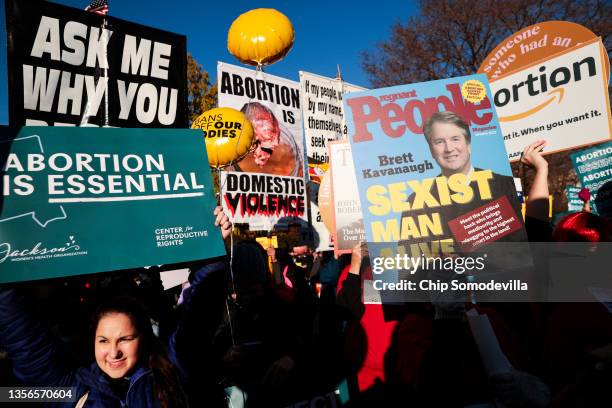 Protesters, demonstrators and activists gather in front of the U.S. Supreme Court as the justices hear arguments in Dobbs v. Jackson Women's Health,...