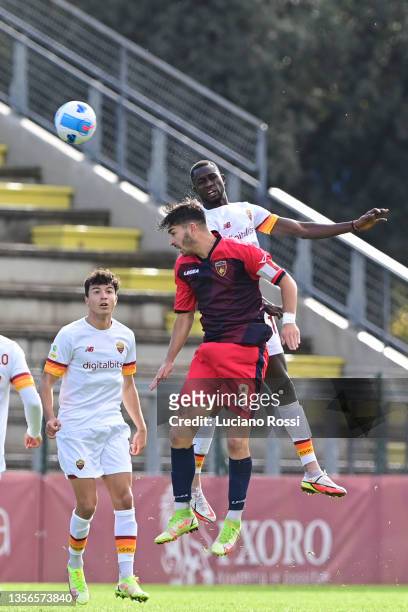 Roma player Ndiaye Maissa Codou competes with Cosenza Calcio player Alessandro Arioli during the Primavera 1 TIMVISION Cup match between AS Roma U19...