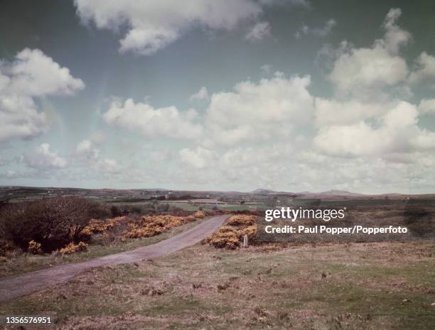 Single track road winds over Bodmin Moor in north east Cornwall, England circa 1955.