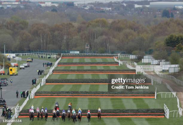 The runners in the Foxhunters Chase head out into the country to take on the Grand National fences during day one of the Aintree Grand National...