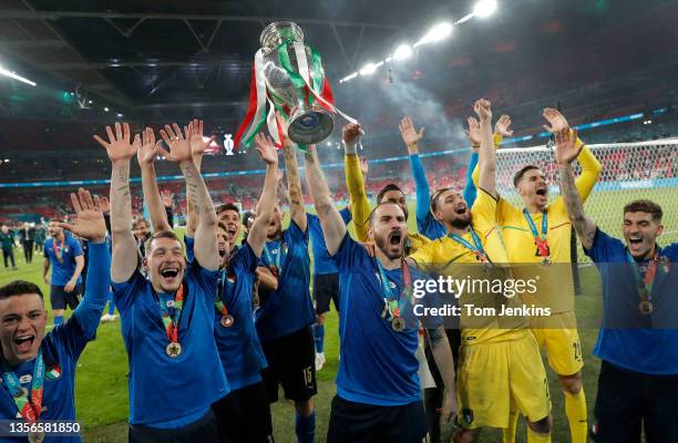 Leonardo Bonucci lifts up the trophy as the Italian team celebrate victory after the Italy v England Euro 2020 final match at Wembley Stadium on July...