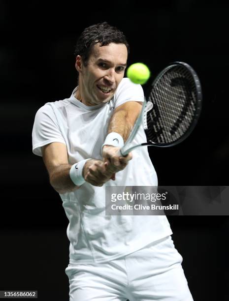 Mikhail Kukushkin of Kazakhstan plays a backhand shot against Miomir Kecmanovic of Serbia during the Davis Cup Quarter Final between Serbia and...