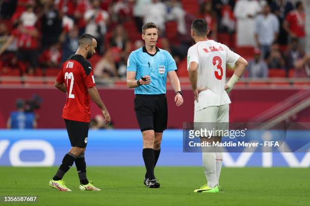 Mohamed Afsha of Egypt and Maher Sabra of Lebanon speak with Match Referee, Daniel Siebert during the FIFA Arab Cup Qatar 2021 Group D match between...