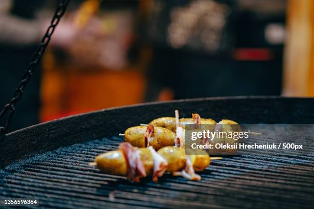 potato with bacon on skewers cooked at the stake - smokey bacon stock pictures, royalty-free photos & images