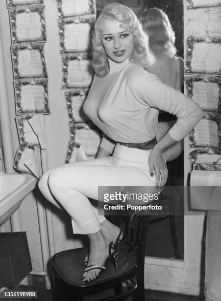 English glamour model and actress Sabrina in her dressing room at the Prince of Wales Theatre, London, 16th July 1957. She is appearing in the revue,...