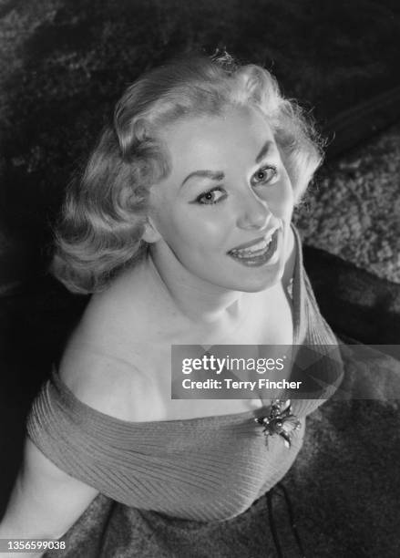 English glamour model and actress Sabrina wearing an off-the-shoulder dress, 15th February 1955. She is at rehearsals for comedian Arthur Askey's new...