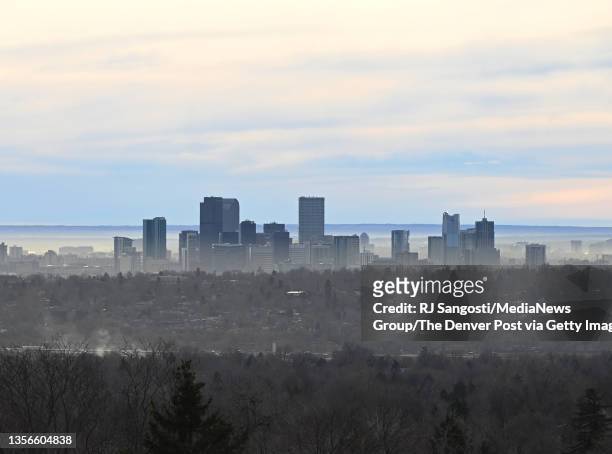 Brown cloud surrounds downtown Denver seen on December 1, 2021 from Arvada, Colorado. Today Denver will see temperatures in the 70s on the first day...