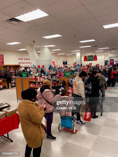 Long line of shoppers at check-out in TJ Maxx store on black Friday, Queens, New York.