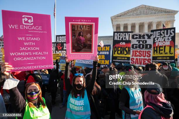 Demonstrators gather in front of the U.S. Supreme Court as the justices hear arguments in Dobbs v. Jackson Women's Health, a case about a Mississippi...