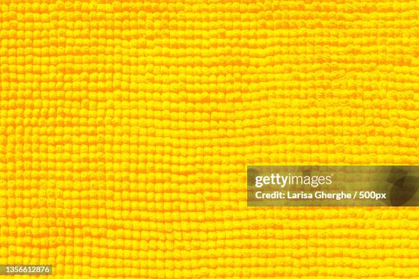 yellow towel close-up fabric and texture background - yellow carpet stock pictures, royalty-free photos & images