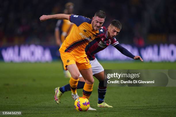 Jordan Veretout of A.S. Roma compete for the ball with Nicolás Domínguez of Bologna FC during the Serie A match between Bologna FC and AS Roma at...