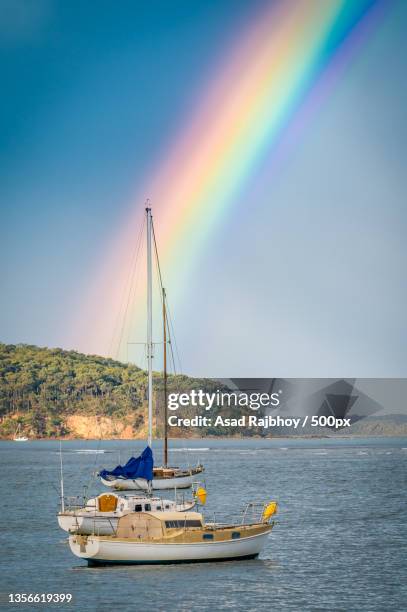 end of the rainbow 2,scenic view of rainbow over sea against sky,batemans bay,new south wales,australia - batemans bay fotografías e imágenes de stock