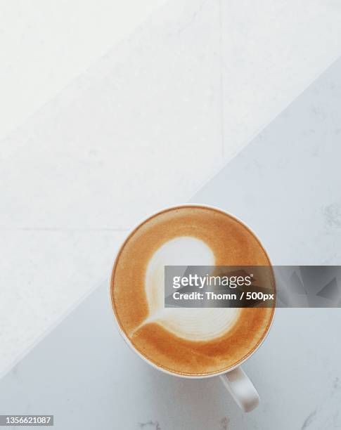 latte in white,high angle view of coffee on table,gia lai,vietnam - coffee art stockfoto's en -beelden