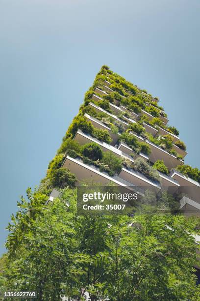 sustainable green architecture building, milan, italy - sustainable design stockfoto's en -beelden