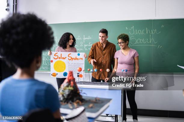 students doing a solar system presentation in the classroom - school science project stock pictures, royalty-free photos & images