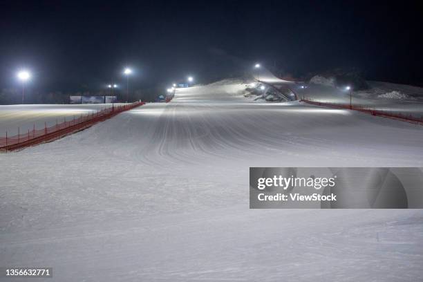 the night under the ski resort - night skiing stock pictures, royalty-free photos & images