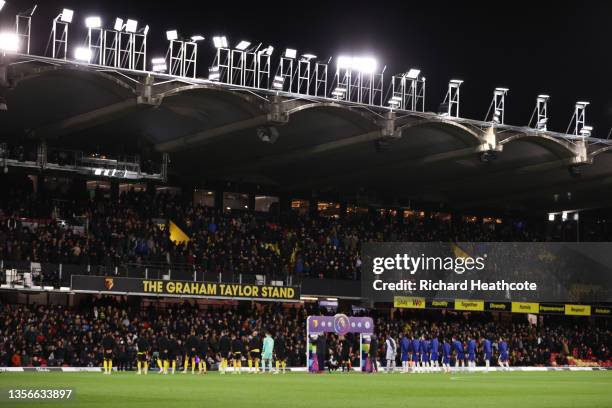 Both teams line up beside the rainbow laces handshake board as clubs show their support to the Stonewall Rainbow Laces campaign prior to the Premier...