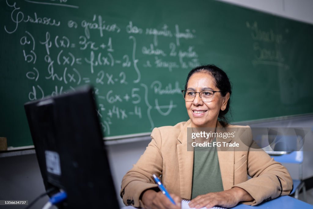 Teacher using laptop to do an online / video class