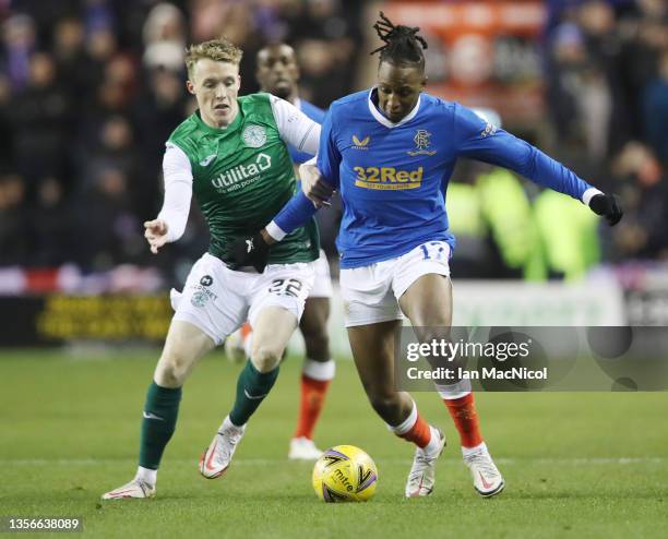 Jake Doyle-Hayes of Hibernian vies with Joe Aribo of Rangers during the Cinch Scottish Premiership match between Hibernian FC and Rangers FC at on...