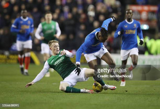 Jake Doyle-Hayes of Hibernian vies with Joe Aribo of Rangers during the Cinch Scottish Premiership match between Hibernian FC and Rangers FC at on...