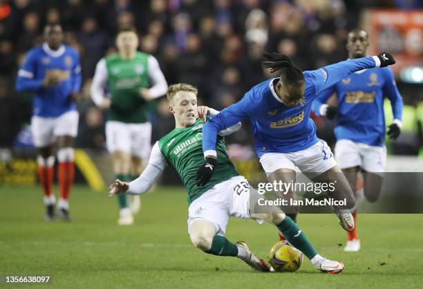 Jake Doyle-Hayes of Hibernian vies with Joe Aribo of Rangers during the Cinch Scottish Premiership match between Hibernian FC and Rangers FC at on...