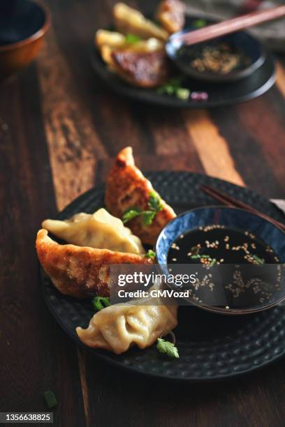 japanese gyoza dumplings - soy sauce stock pictures, royalty-free photos & images