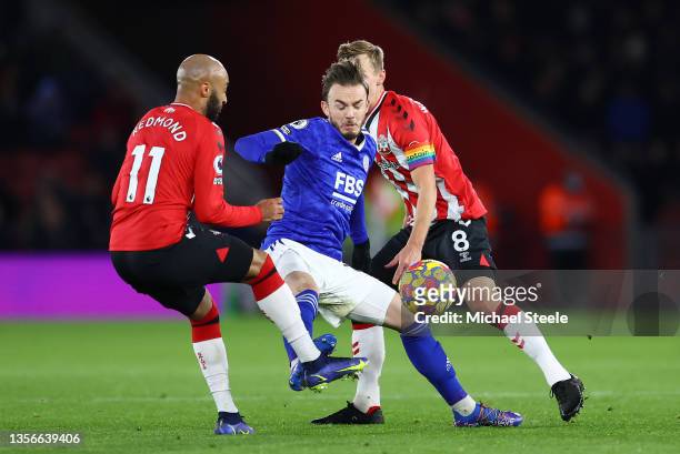 James Maddison of Leicester City is challenged by Nathan Redmond of Southampton during the Premier League match between Southampton FC and Leicester...
