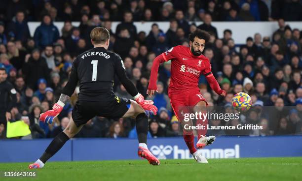 Mohamed Salah of Liverpool scores their side's second goal past Jordan Pickford of Everton during the Premier League match between Everton and...