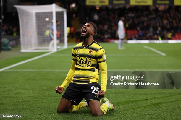 Emmanuel Dennis of Watford FC celebrates after scoring their side's first goal during the Premier League match between Watford and Chelsea at...