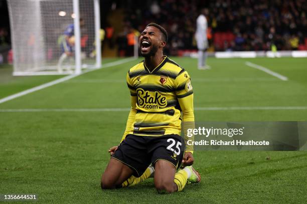 Emmanuel Dennis of Watford FC celebrates after scoring their side's first goal during the Premier League match between Watford and Chelsea at...
