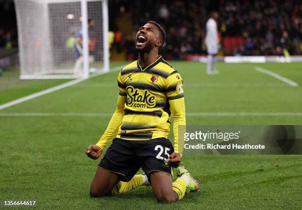 Emmanuel Dennis of Watford FC celebrates after scoring their side's first goal during the Premier League match between Watford and Chelsea at...