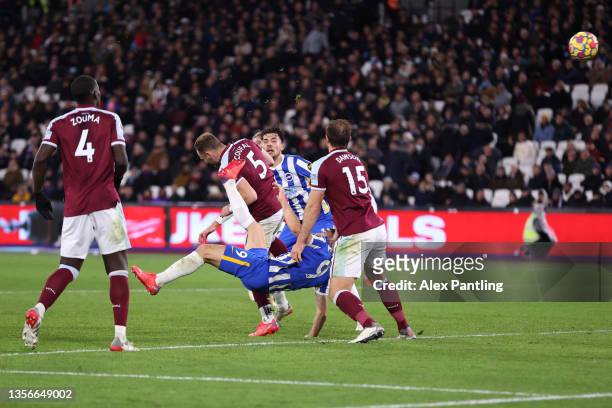 Neal Maupay of Brighton & Hove Albion scores their side's first goal during the Premier League match between West Ham United and Brighton & Hove...