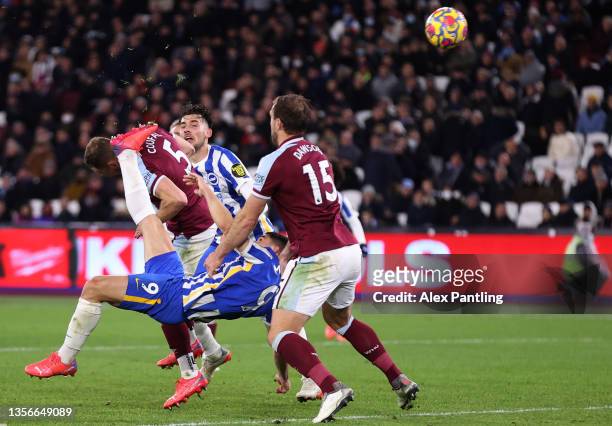 Neal Maupay of Brighton & Hove Albion scores their side's first goal during the Premier League match between West Ham United and Brighton & Hove...