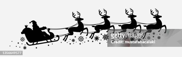 santa and flying reindeers - deer antler silhouette stock illustrations