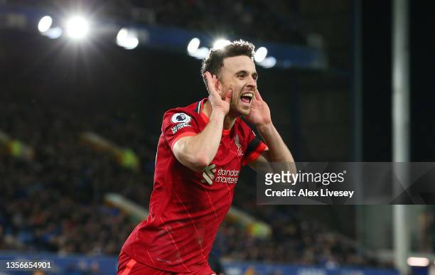 Diogo Jota of Liverpool celebrates after scoring their side's fourth goal during the Premier League match between Everton and Liverpool at Goodison...